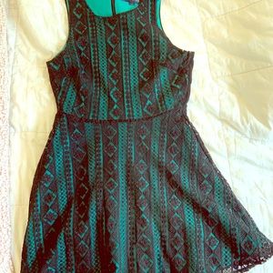 Green and black lace dress